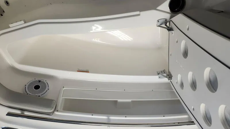 Slide: The Image of 2024 Pursuit DC 246 Dual Console interior with seating and speaker system. - 11