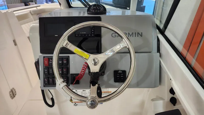 Slide: The Image of 2024 Pursuit DC 246 Dual Console helm with Garmin navigation system. - 7