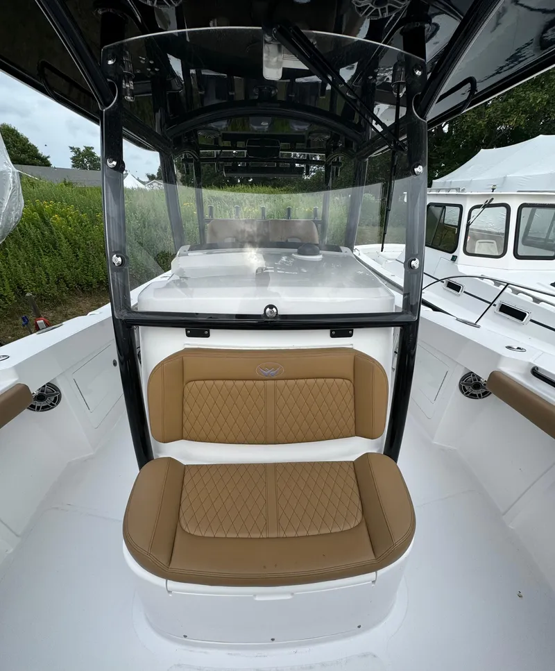 Slide: The Image of 2020 Southport 33 FE boat with tan seating and black frame. - 14