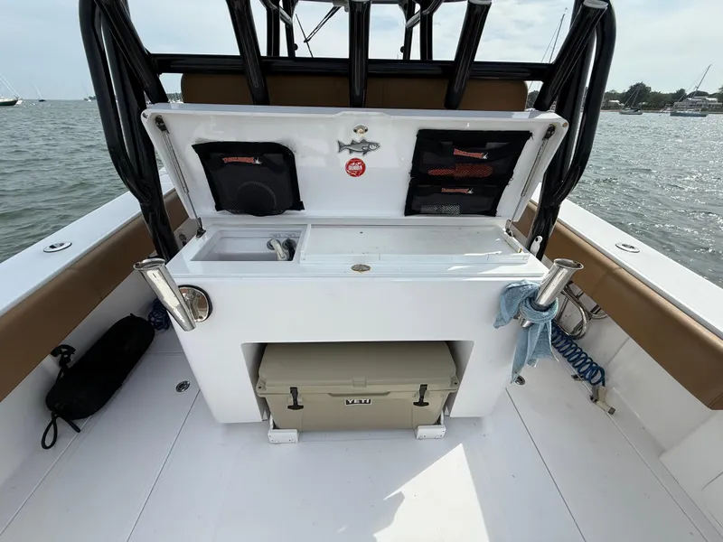 Slide: The Image of 2020 Southport 33 FE boat interior with fishing station and storage compartments. - 18