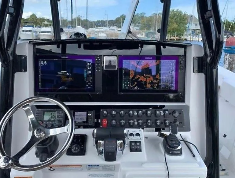 Slide: The Image of Control panel of a 2020 Southport 33 FE boat with navigation screens. - 5