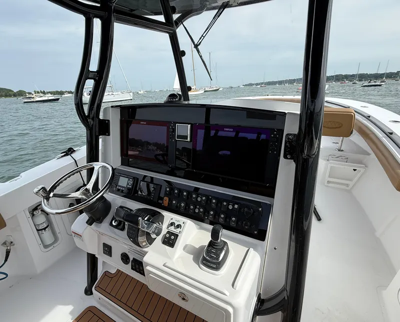 Slide: The Image of 2020 Southport 33 FE boat helm with advanced navigation system and steering wheel. - 6