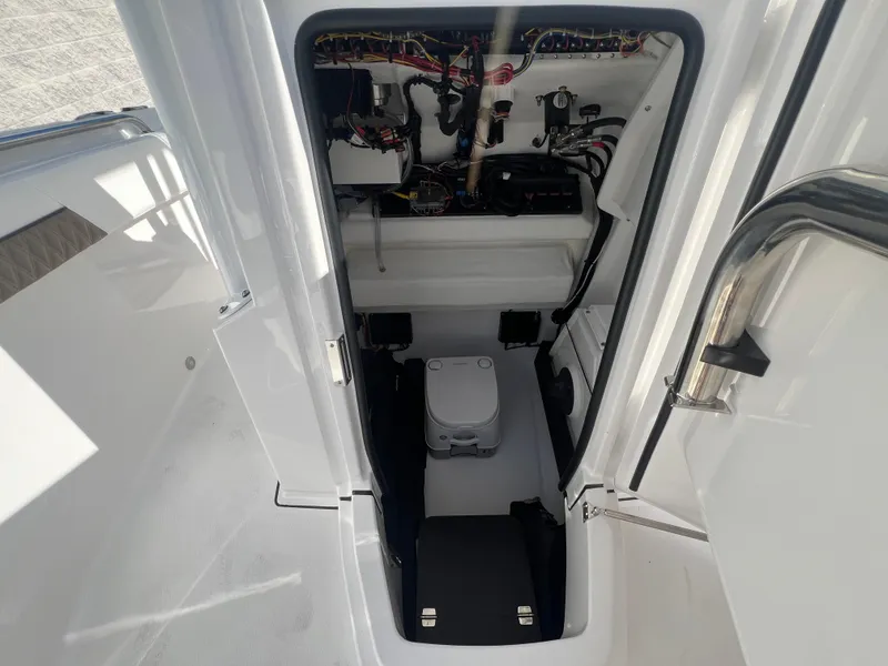 Slide: The Image of 2025 Blackfin 222 CC boat interior with wiring and equipment. - 12