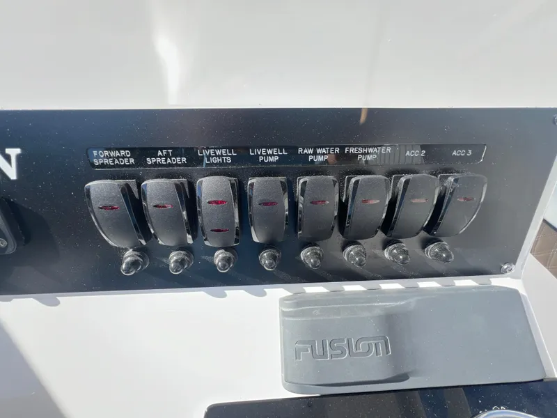 Slide: The Image of Control panel of a 2025 Blackfin 222 CC boat with labeled switches. - 22
