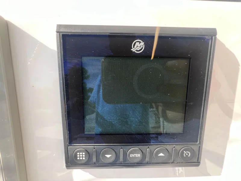Slide: The Image of Close-up of the 2025 Blackfin 222 CC boat's digital display screen. - 24