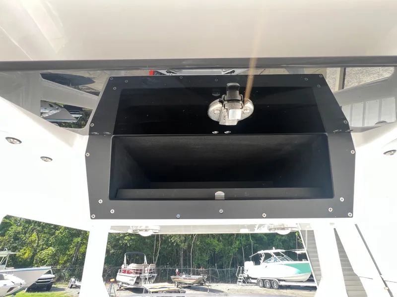 Slide: The Image of 2025 Blackfin 222 CC center console storage compartment. - 28