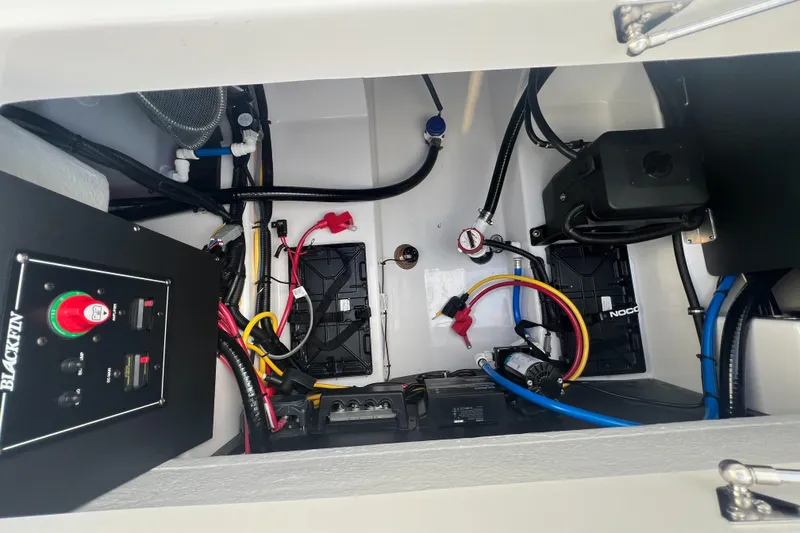Slide: The Image of Electrical and mechanical components inside a 2025 Blackfin 222 CC boat. - 29