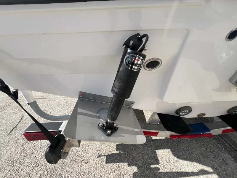 Slide: The Image of Close-up of 2025 Blackfin 222 CC boat's trim tab and hydraulic actuator. - 32