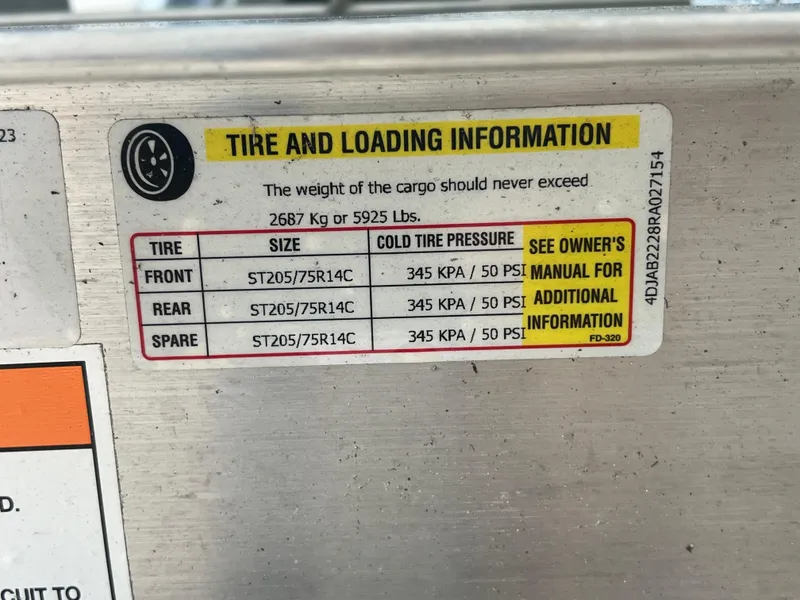 Slide: The Image of Tire and loading information label on 2025 Blackfin 222 CC boat. - 37