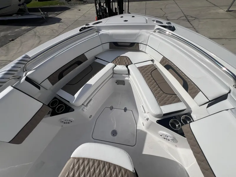 Slide: The Image of 2025 Blackfin 222 CC boat interior with cushioned seating and storage compartments. - 5