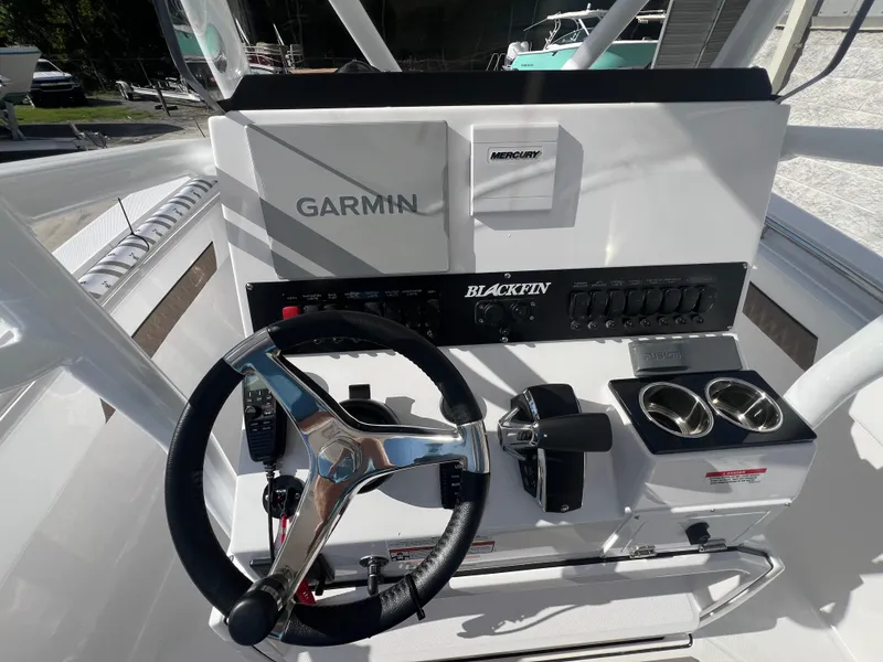 Slide: The Image of 2025 Blackfin 222 CC boat console with Garmin and Mercury controls. - 9