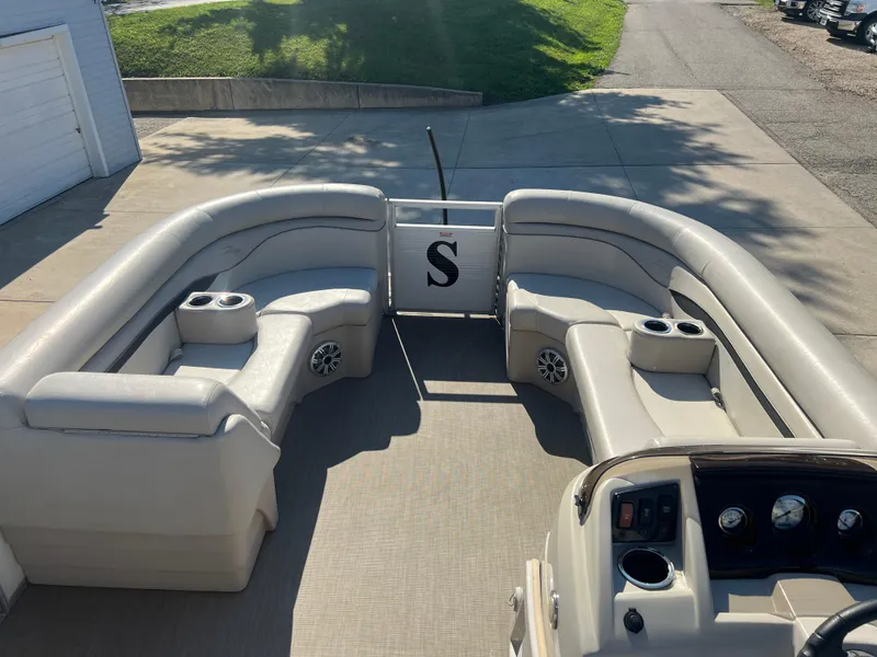 Slide: The Image of 2017 Bennington 24SPDX pontoon boat interior with plush seating and cup holders. - 13