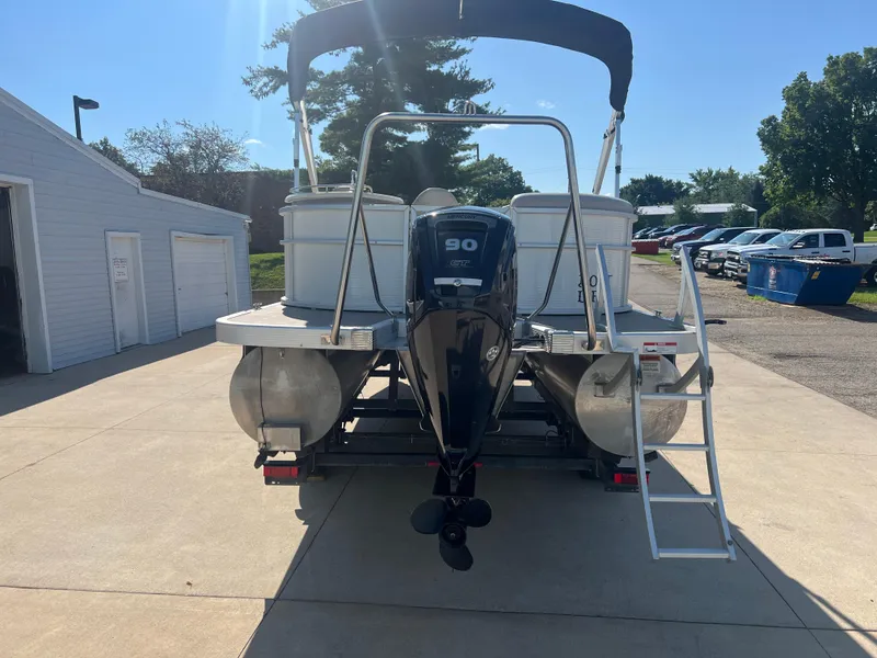 Slide: The Image of 2017 Bennington 24SPDX pontoon boat with 90 HP outboard motor. - 7