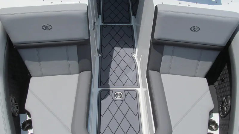 Slide: The Image of 2025 Cobalt R4 boat interior with gray seating and diamond-patterned flooring. - 12
