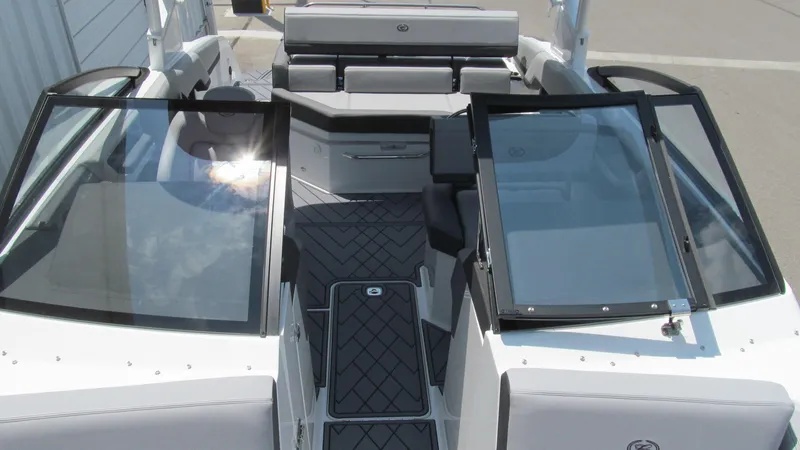 Slide: The Image of 2025 Cobalt R4 boat interior with open windshield and seating area. - 13