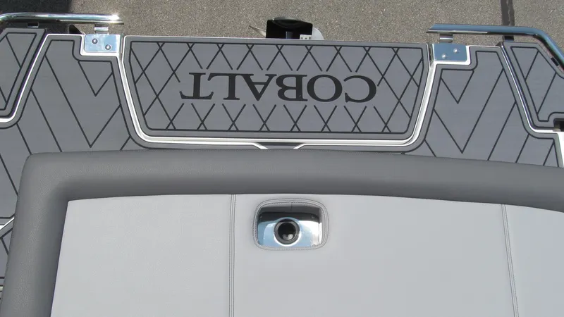 Slide: The Image of 2025 Cobalt R4 boat deck with logo and cushioned seating. - 17