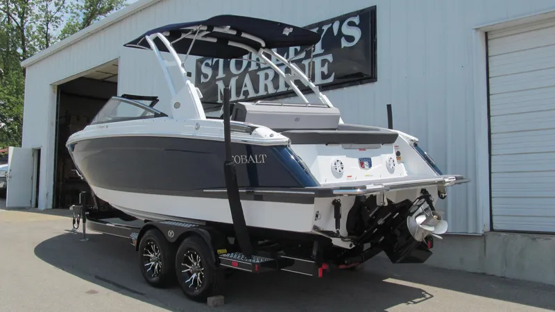 Slide: The Image of 2025 Cobalt R4 boat on trailer outside marine dealership. - 3