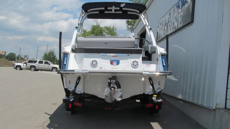 Slide: The Image of 2025 Cobalt R4 boat rear view at a marina. - 4