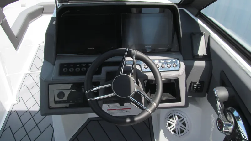 Slide: The Image of 2025 Cobalt R4 boat dashboard with steering wheel and digital displays. - 7