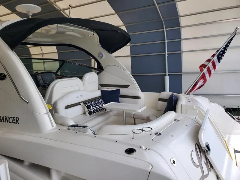 Slide: The Image of 2007 Sea Ray 380 Sundancer yacht with American flag in covered dock. - 3