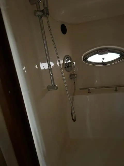 Slide: The Image of Shower area in 2007 Sea Ray 380 Sundancer yacht with porthole window. - 6