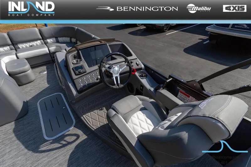 Slide: The Image of 2024 Bennington 23 RFB boat interior with modern helm and luxurious seating. - 13