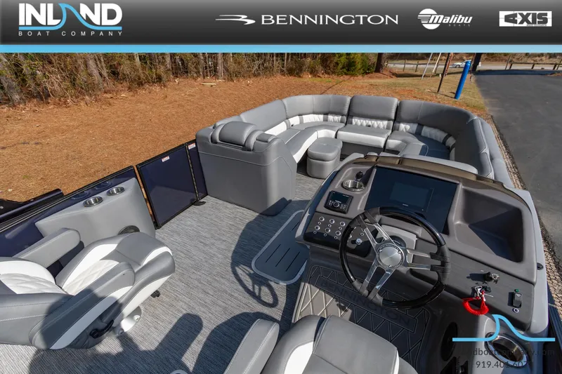 Slide: The Image of 2024 Bennington 23 RFB pontoon boat interior with luxurious seating and modern dashboard. - 16