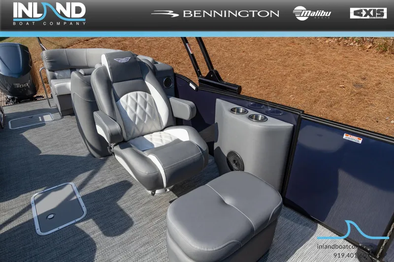 Slide: The Image of 2024 Bennington 23 RFB boat interior with luxurious seating and cup holders. - 18