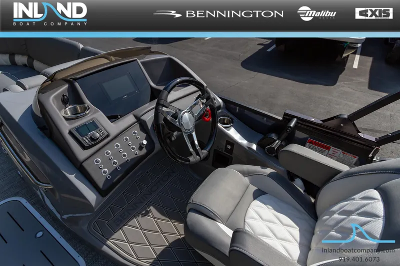 Slide: The Image of 2024 Bennington 23 RFB boat cockpit with steering wheel and control panel. - 20