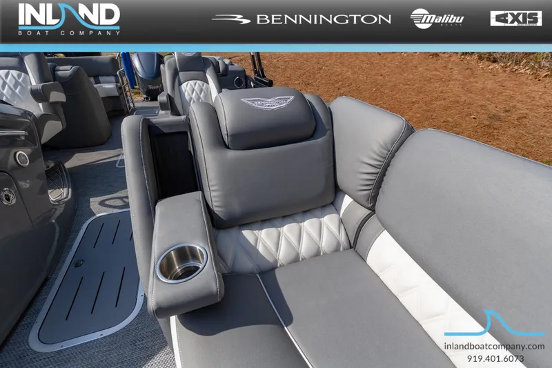 Slide: The Image of 2024 Bennington 23 RFB luxury boat interior with gray and white seating. - 26