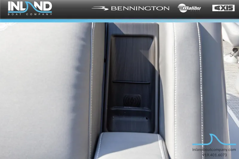 Slide: The Image of 2024 Bennington 23 RFB boat interior with sleek seating and storage compartment. - 27