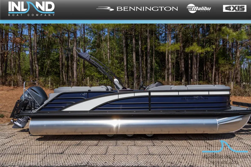 Slide: The Image of 2024 Bennington 23 RFB pontoon boat displayed outdoors with forest background. - 4