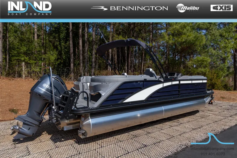 Slide: The Image of 2024 Bennington 23 RFB pontoon boat displayed outdoors by Inland Boat Company. - 5