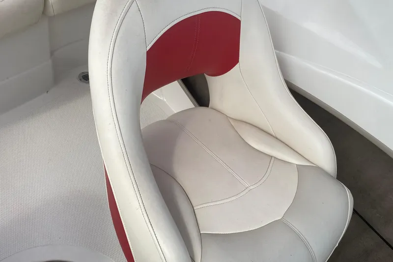 Slide: The Image of 2010 Tahoe Q5i boat seat with white and red upholstery. - 10