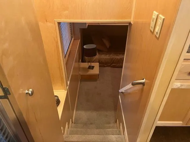 Slide: The Image of Interior of 2007 Thoroughbred houseboat with stairs leading to a cozy bedroom. - 14