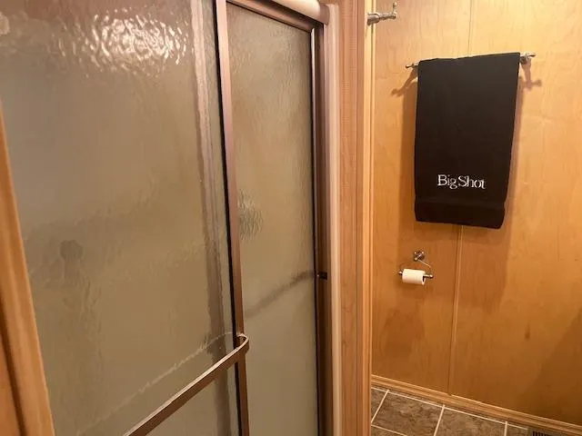 Slide: The Image of Houseboat bathroom with shower, towel rack, and toilet paper holder, Thoroughbred model, 2007. - 15