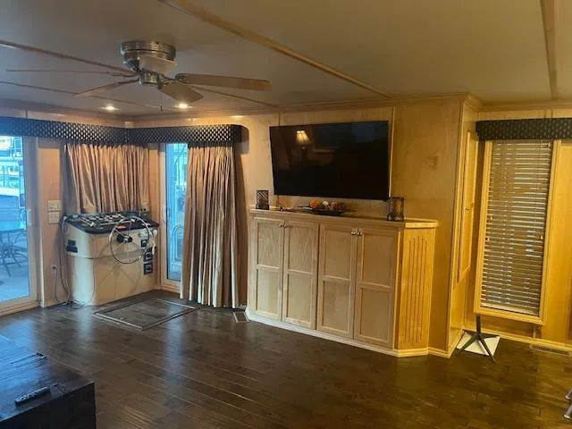 Slide: The Image of Interior of a 2007 Thoroughbred houseboat with wooden cabinetry and modern amenities. - 3