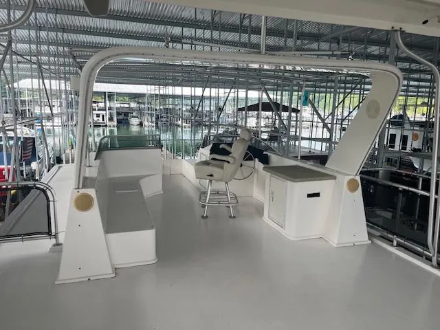 Slide: The Image of Upper deck of a 2007 Thoroughbred houseboat in a marina. - 35