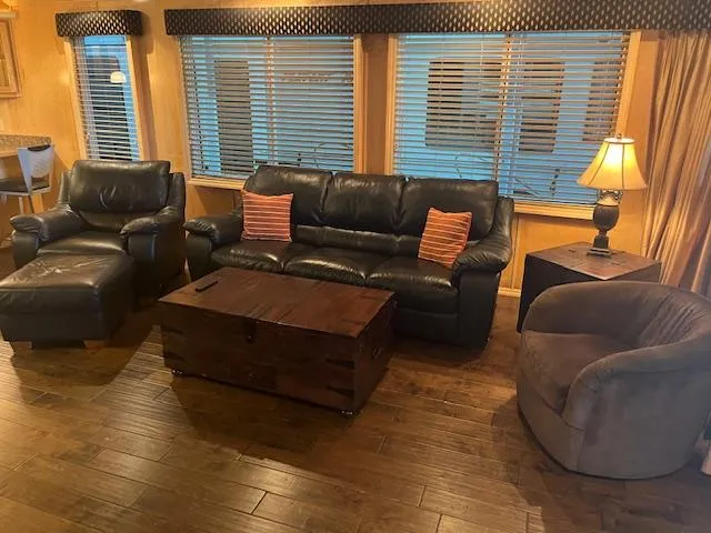 Slide: The Image of 2007 Thoroughbred houseboat living area with leather furniture and wooden flooring. - 6