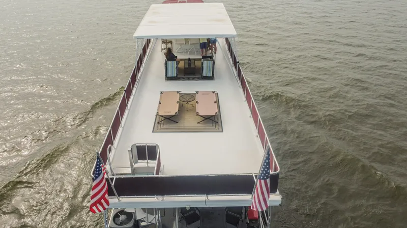 Slide: The Image of Aerial view of 2002 Sumerset 75 houseboat on open water. - 10