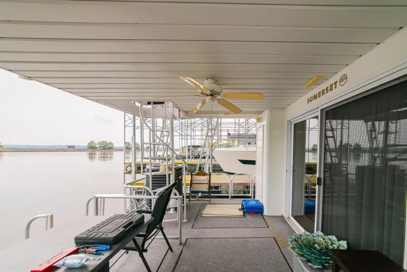 Slide: The Image of 2002 Sumerset 75 houseboat deck with ceiling fan and lake view. - 13