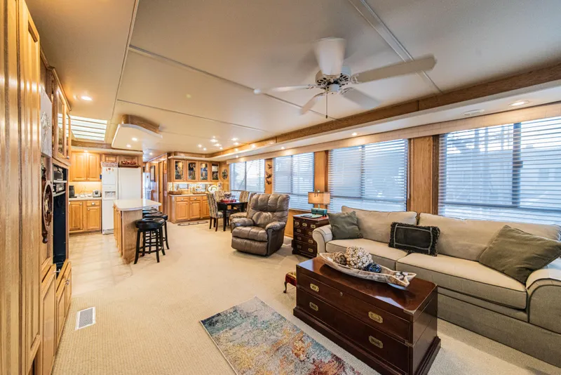 Slide: The Image of Luxurious interior of a 2002 Sumerset 75 houseboat with modern furnishings and spacious layout. - 16