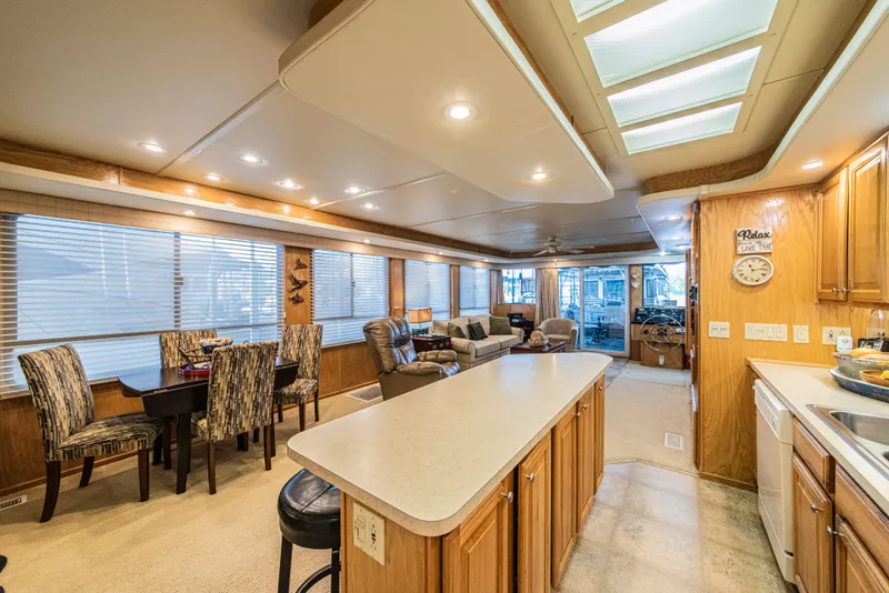 Slide: The Image of Luxurious 2002 Sumerset 75 houseboat interior with modern kitchen and cozy living area. - 19