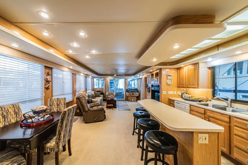 Slide: The Image of Luxurious 2002 Sumerset 75 houseboat interior with modern kitchen and cozy living area. - 20