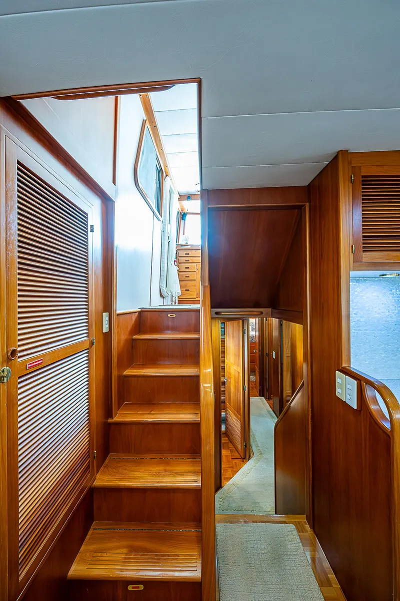 Slide: The Image of Interior of 2001 Kadey-Krogen 58 yacht with wooden stairs and cabinetry. - 15