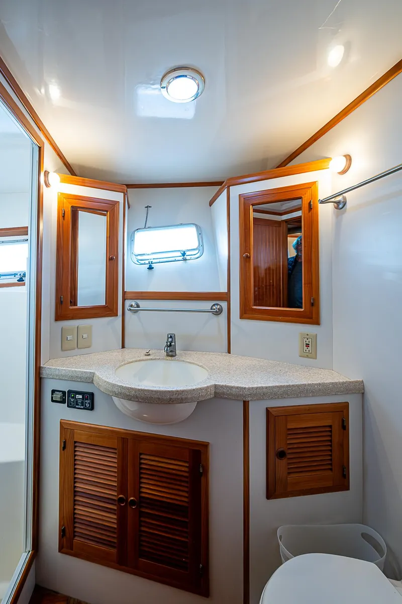 Slide: The Image of Kadey-Krogen 58 yacht bathroom, 2001 model, featuring wooden cabinets and modern fixtures. - 31