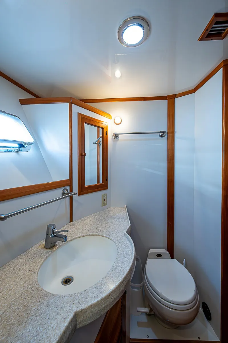 Slide: The Image of Bathroom interior of 2001 Kadey-Krogen 58 yacht with sink and toilet. - 32