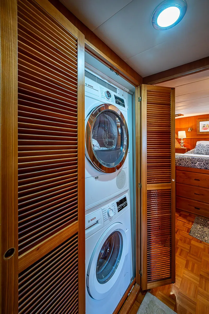 Slide: The Image of Stacked washer and dryer in wooden closet on 2001 Kadey-Krogen 58 yacht. - 34