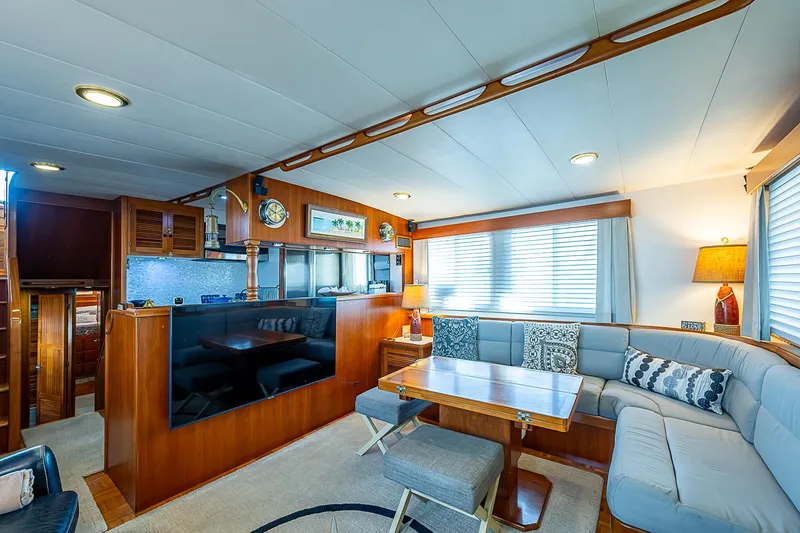 Slide: The Image of Luxurious interior of 2001 Kadey-Krogen 58 yacht with elegant wood finishes and cozy seating. - 4