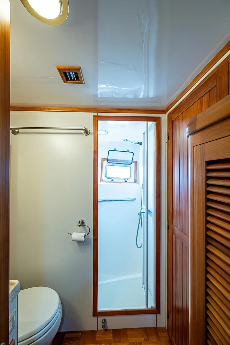 Slide: The Image of Kadey-Krogen 58 yacht bathroom, 2001 model, featuring wooden accents and compact shower. - 40